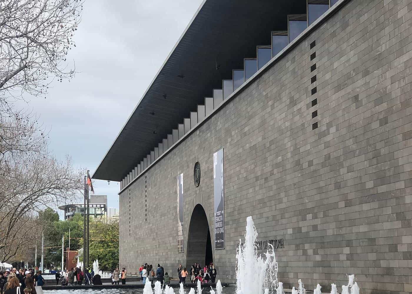 The bluestone facade and arched entrance of NGV International on St Kilda Road
