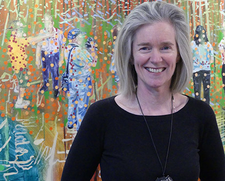 ACU Curator Caroline Field with Jon Cattapan oil on canvas 'Transported Group No. 1' at the Melbourne Campus.